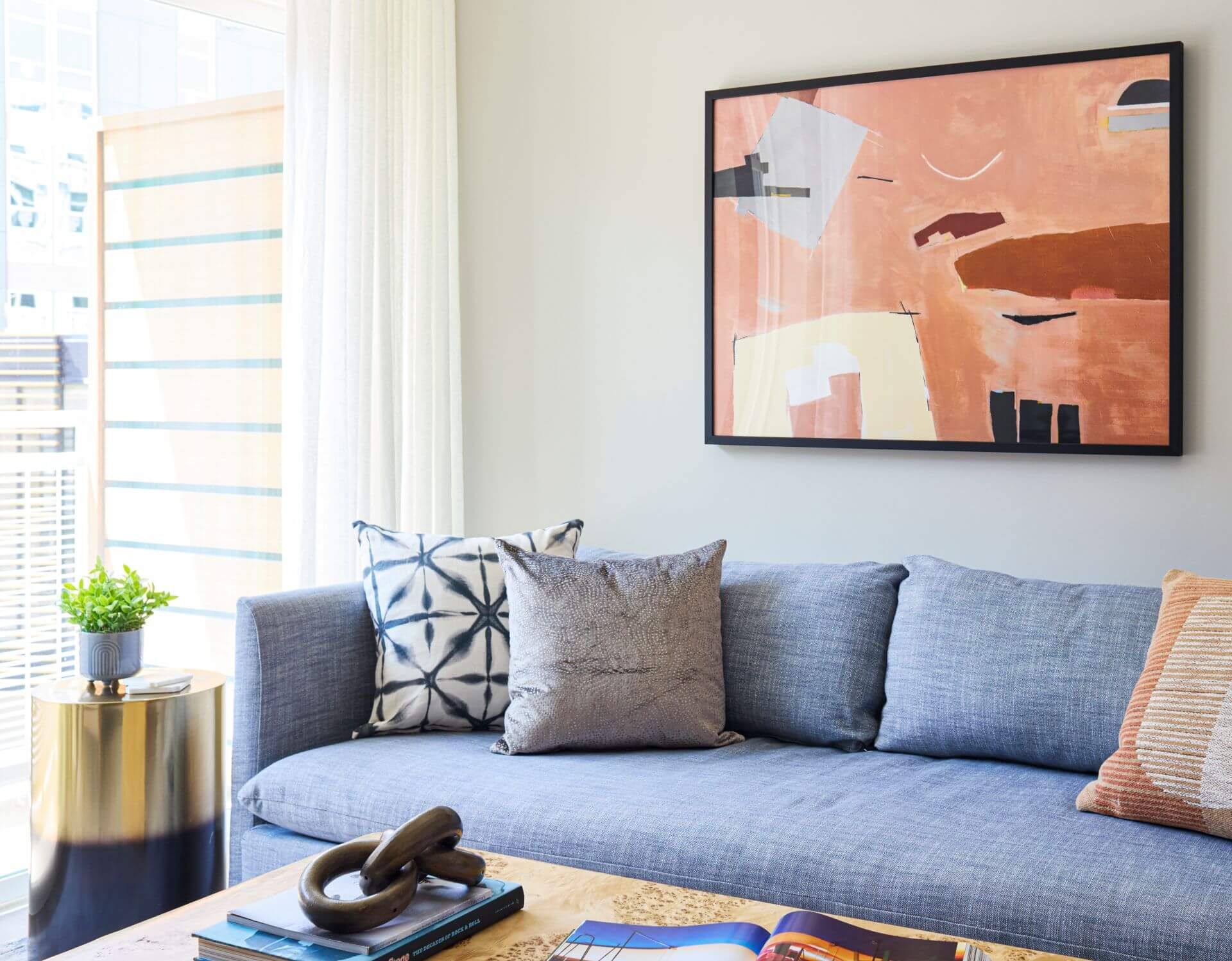 Living room with floor to ceiling windows in apartment at Aster College Park, MD